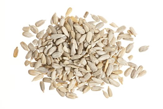 Heap of raw shelled sunflower seeds isolated on white background from above