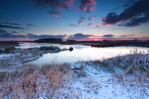 winter sunrise over river in snow, Onlanden, Drenthe, Netherlands