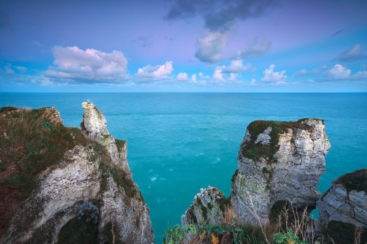 sunrise over cliffs in ocean, Etretat, France