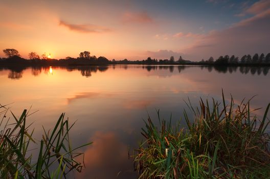 gold sunrise over lake, Drenthe, Netherlands