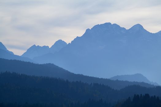 high mountains in misty dusk, Bavaria, Germany