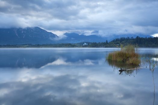 clouded sky over Barmsee lake in Bavarian alps