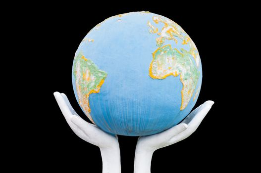 Globe ,earth in human hand on black background