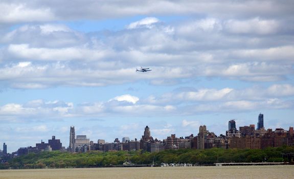 A space shuttle atop a flying 747 plane
