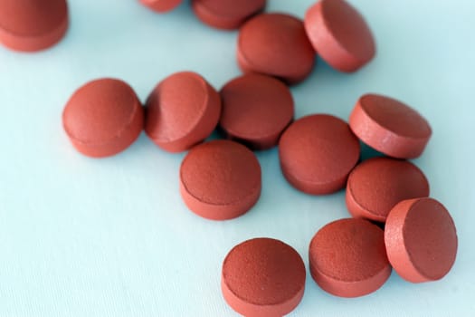 A pile of brown tablet medicine like pills