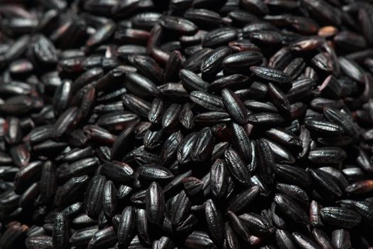A pile of black grain rice seen from above