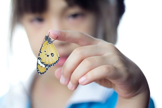 Beautiful butterfly sitting on the girl hand 