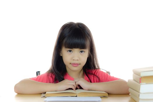 Portrait of a cute asian school girl on the desk, with pile of book