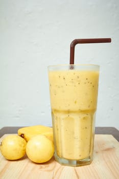 Smoothie Mango with Passion fruit on wood 