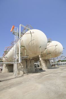 Gas storage tanks with blue sky in industrial plant