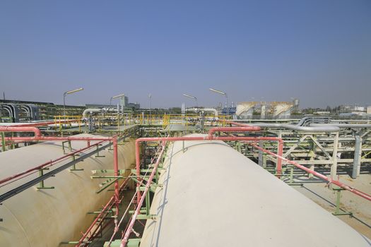 Gas storage tanks with blue sky in industrial plant