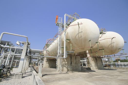 Gas storage tanks with blue sky in industrial plant