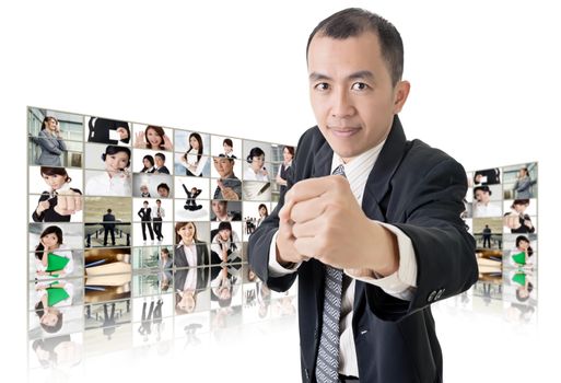 Asian business man or boss standing in front of tV screen wall showing pictures of business concept.