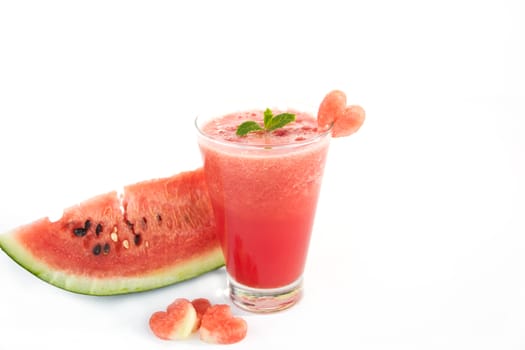 Water melon juice with water melon slice and heart shape on white
