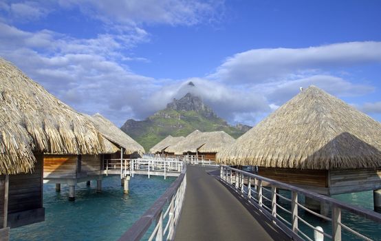 bora bora otemanu mountain with lagoon bungalows and blue sky