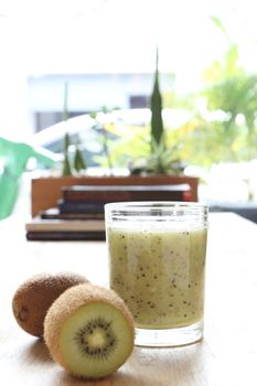 Kiwi smoothie and kiwi fruit wood background 