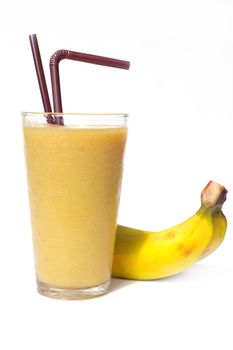 Banana smoothie in glass with fresh banana on white background 