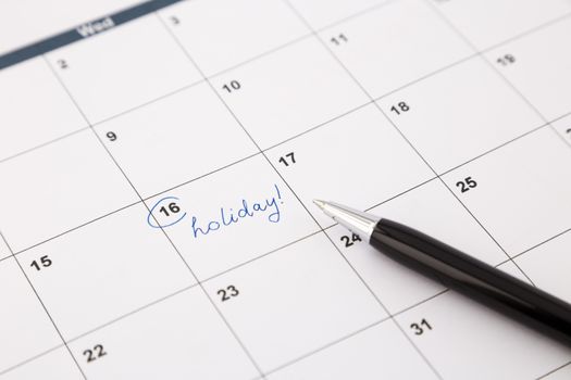 note date of holiday planning on calendar