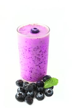 Blueberry smoothie with fresh blueberry on white background