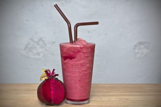 Healthy drink, Smoothie beetroot on glass with fresh beetroon on wood 