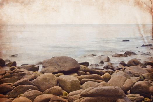 Ocean and rocky coast in retro grunge style for background