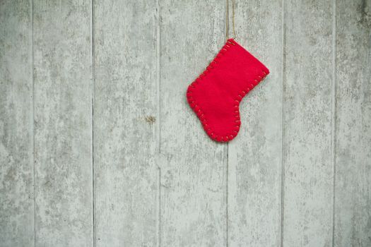 Red sock christmas on the old wood 