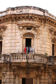 Clothes hanging out to dry in a balcony in a Colonial style building in Old Havana, Cuba