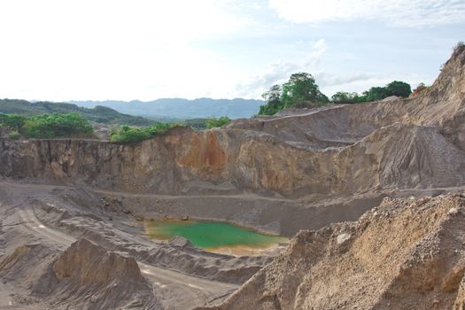 Blue lake in mining industrial crater