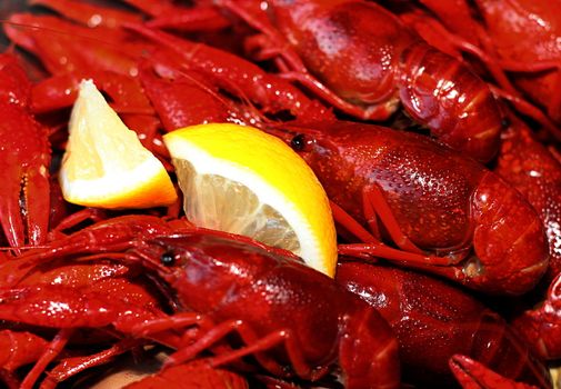 Red cooked crawfish complete with a chunk of lemon