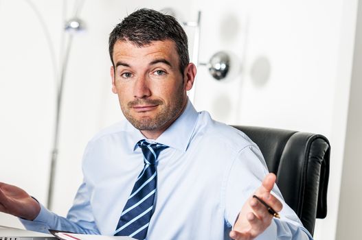 busy man hiding behind a stack of files