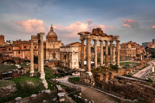 Roman Forum (Foro Romano) and Ruins of Septimius Severus Arch and Saturn Temple at Sunset, Rome, Italy