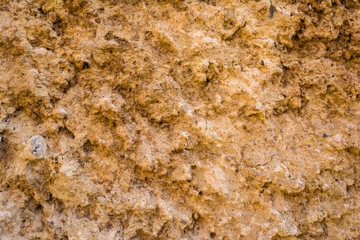 A natural wall of rough stone