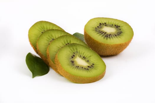 Fresh kiwi with slices and leaves
