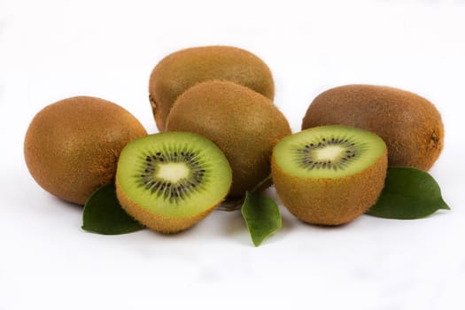 Fresh kiwi with half and leaves