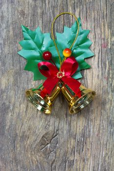 Bells with Christmas decoration on wood background