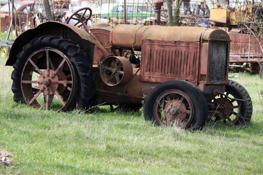old rusty tractor on field