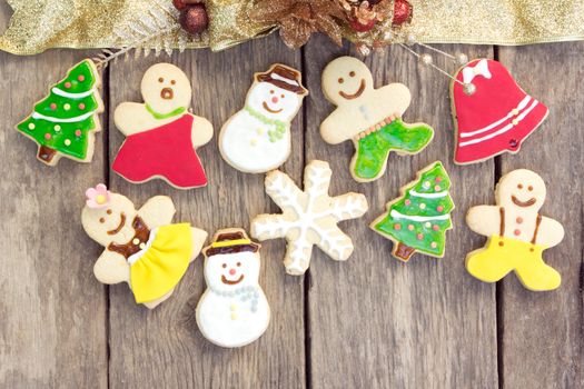 Gingerbread cookies on old wood background
