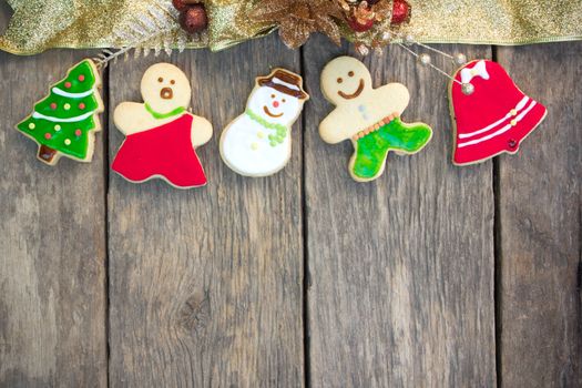 Gingerbread cookies on old wood background