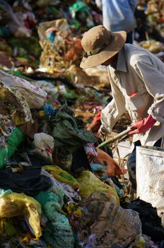 DA LAT, VIET NAM-SEPTEMBER 5: People pick up garbage at landfill in Da Lat, Viet Nam on September 5, 2013