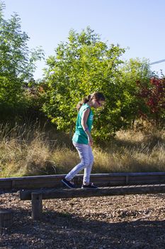 Young girl on balance beam