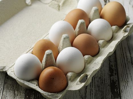 raw chiken eggs in the paper box