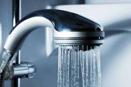 Water from the shower in the modern bathroom