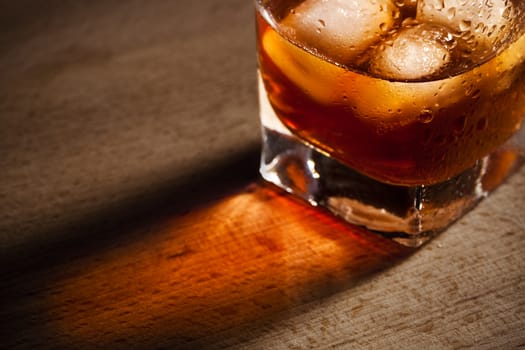 water droplets on a glass of whiskey