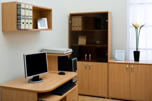 computer on a desk in a modern office