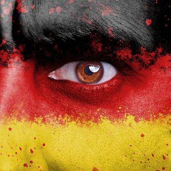 Germany flag painted on angry man face