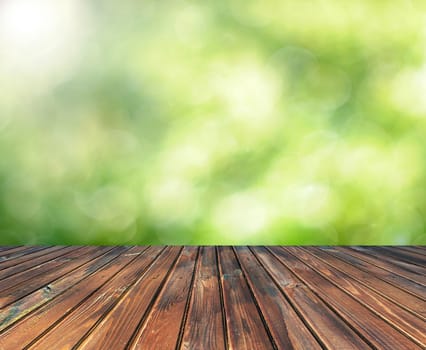 wooden table with space for your photo montage and green color of background