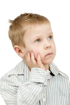 Studio portrait of young pensive beautiful boy on white background