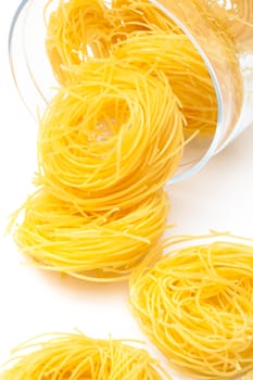 pasta in glass jar on a white background