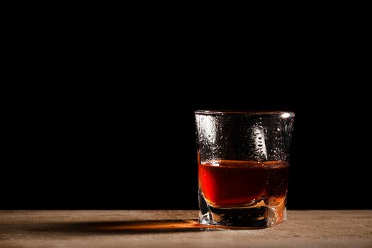 glass from whisky on a wooden table