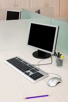 computers on a desk in a modern office